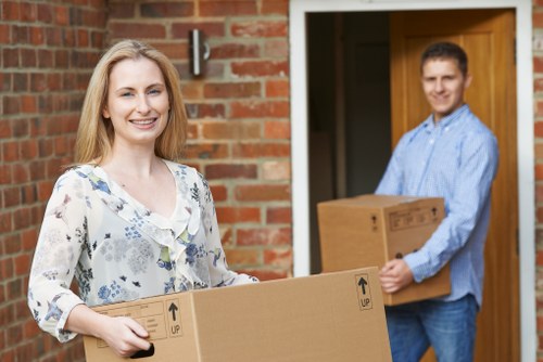 Moving van and packed boxes for house removals in Shacklewell