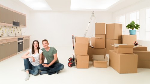 Professional movers handling furniture during a Shacklewell relocation