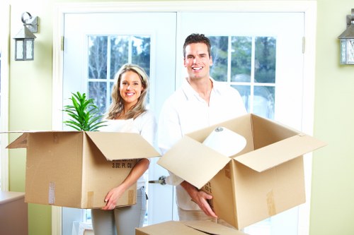 Careful loading of household items during a small removal service